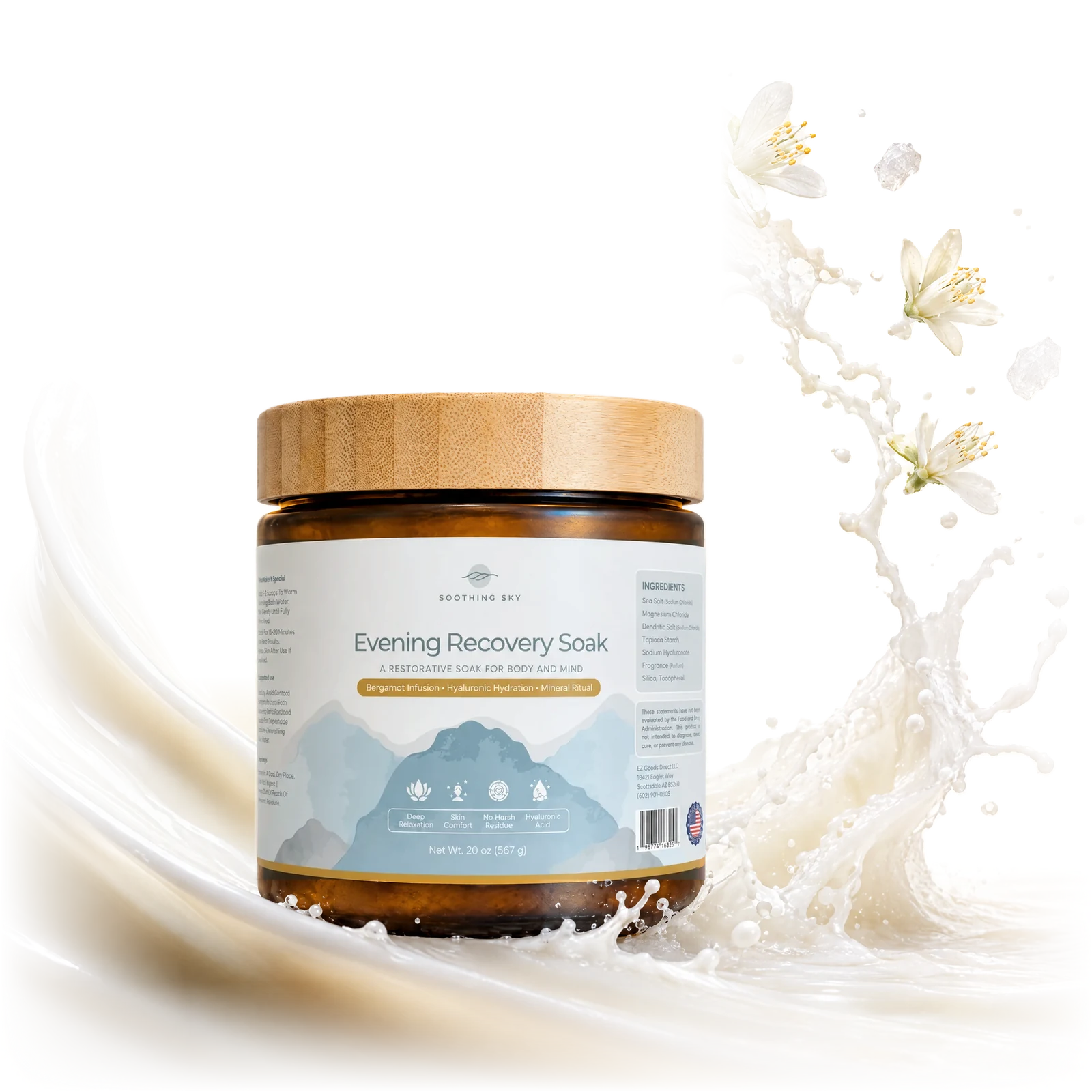 Evening Recovery Soak in its amber jar with a bamboo lid, in a swirl of milky bath water, with bergamot blossoms and sea salt crystals flying out of it.